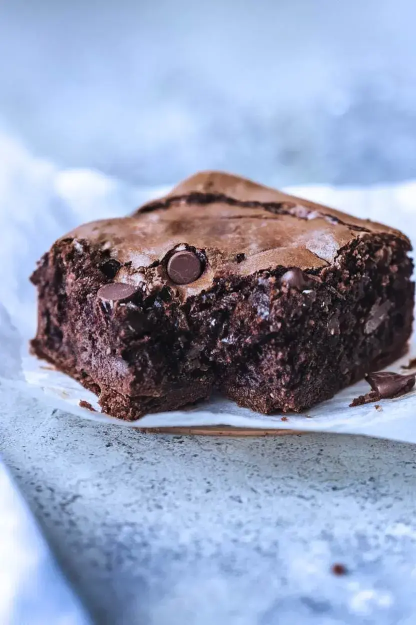 One piece of banana brownies with a bite taken out.